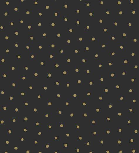 papel negro con puntos dorados